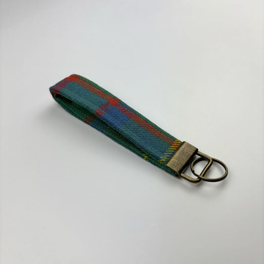 MacIntosh Hunting Ancient Tartan Keyring, angled on white, brass ring and tab