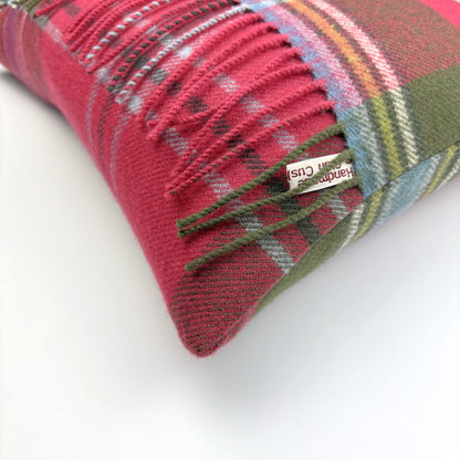 MacLean of Duart Weathered Fringed Tartan Cushion, close-up of corner with cream label on white