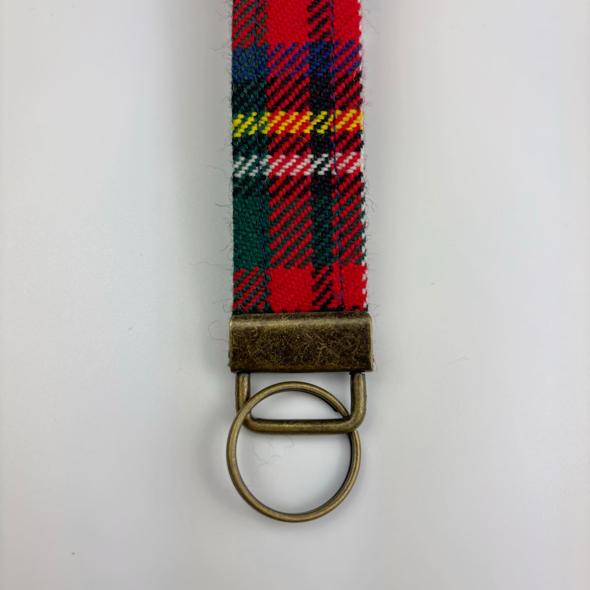 Stewart Royal Modern Tartan Keyring, close-up of strap end with brass ring and tab